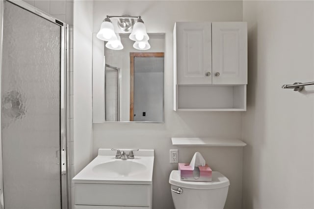 bathroom with walk in shower, vanity, and toilet