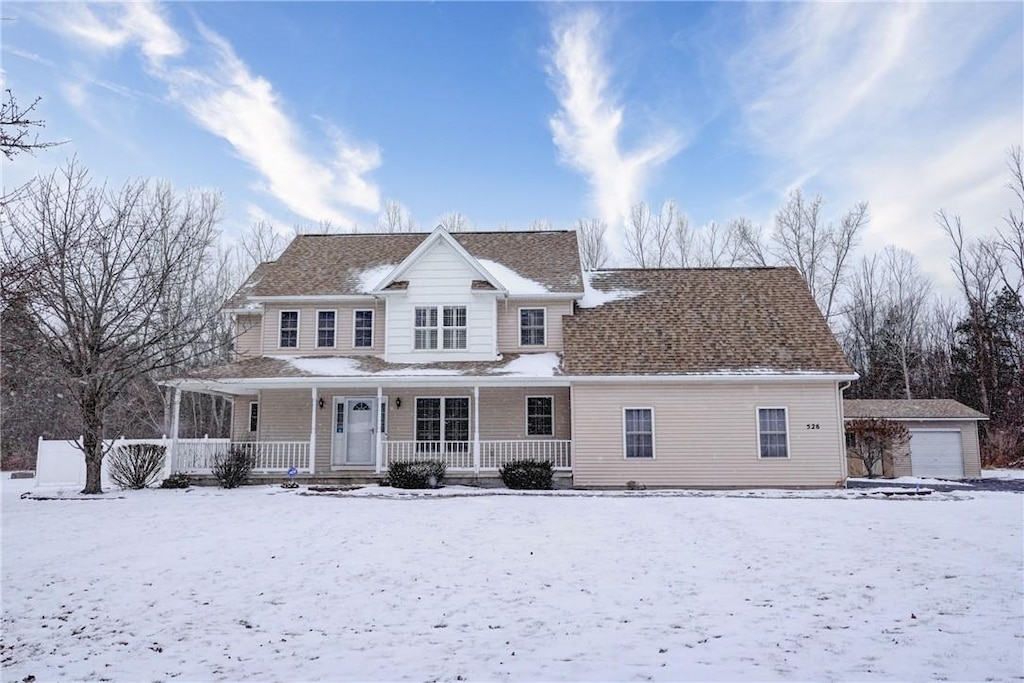 view of front of house featuring covered porch and a garage