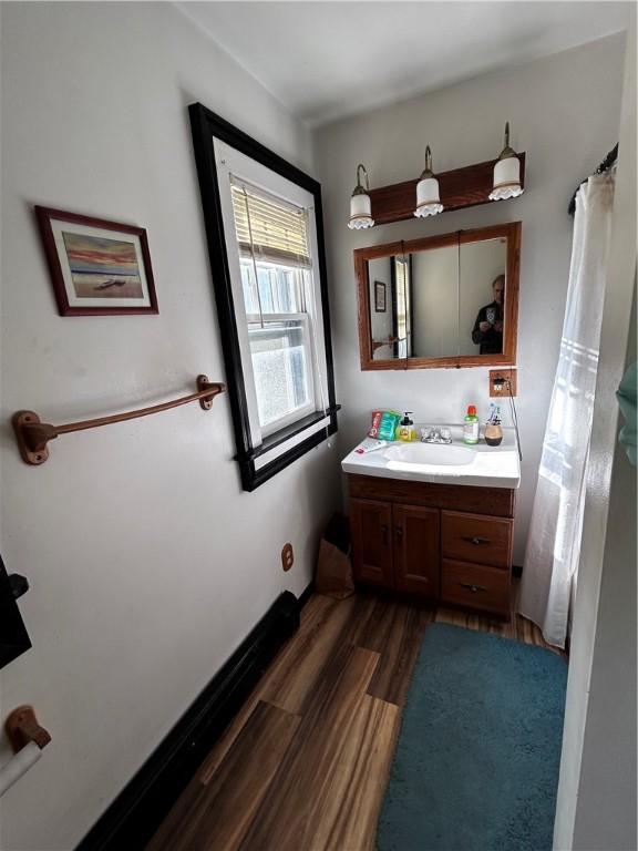 bathroom with vanity and hardwood / wood-style floors