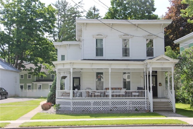 view of front of house featuring a porch and a front yard