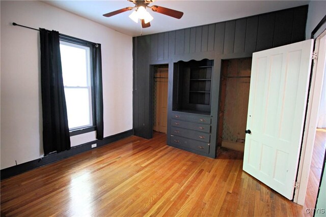 unfurnished bedroom featuring ceiling fan and light hardwood / wood-style flooring