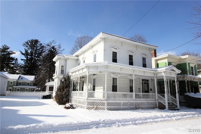 italianate home featuring a porch