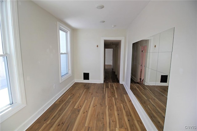 empty room with wood-type flooring