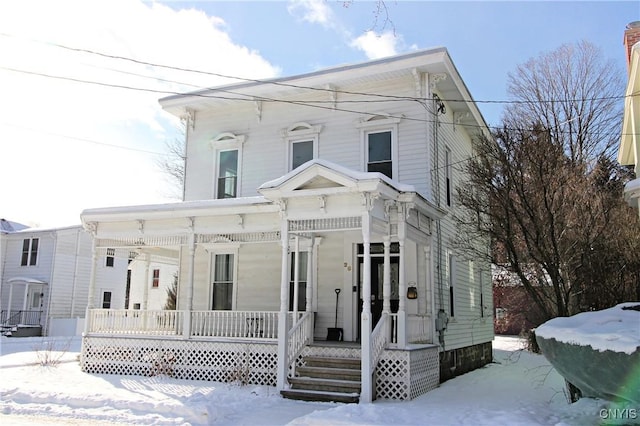 italianate home featuring a porch