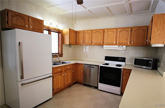 kitchen featuring sink, backsplash, and appliances with stainless steel finishes