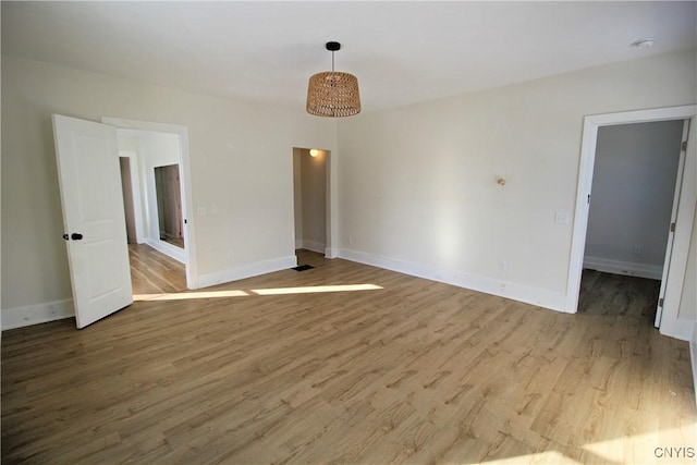 unfurnished room featuring light wood-type flooring