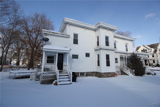 view of snow covered house