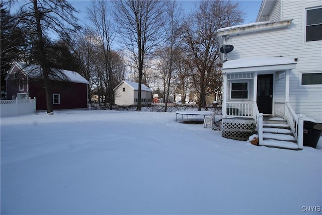 view of yard layered in snow