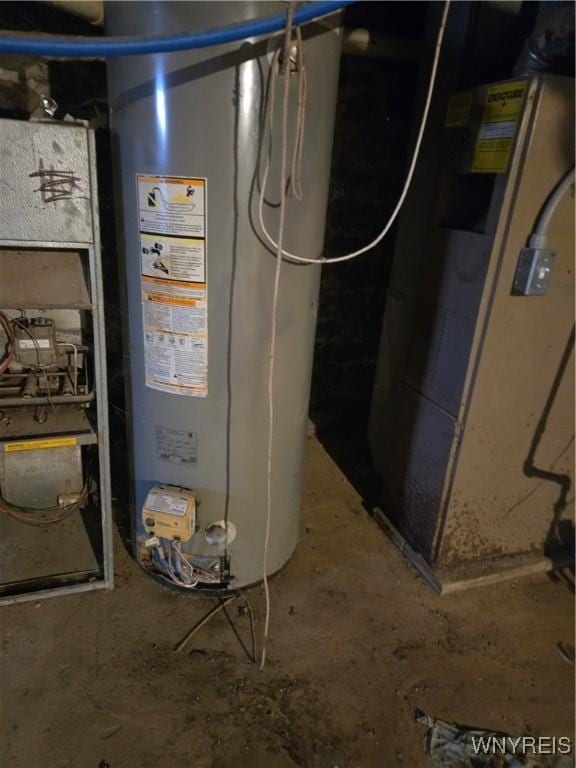 utility room featuring gas water heater