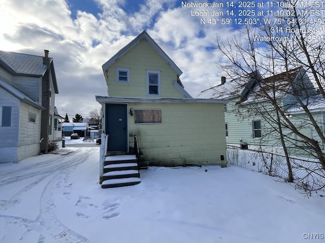 view of snow covered house