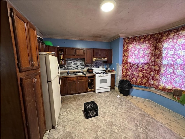 kitchen with sink, white appliances, ornamental molding, and tasteful backsplash