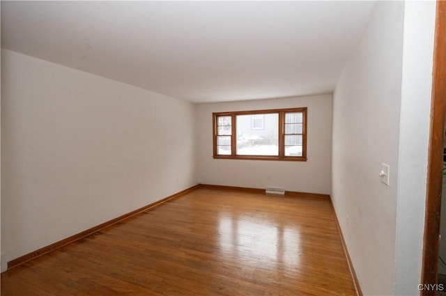 spare room featuring hardwood / wood-style floors