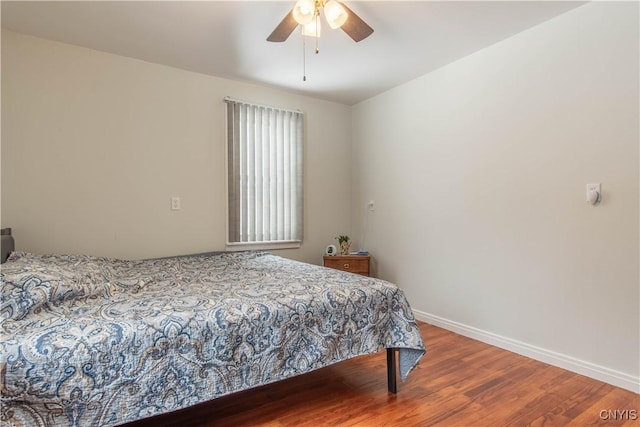 bedroom featuring ceiling fan and wood-type flooring