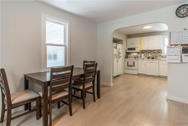 dining area with light hardwood / wood-style floors