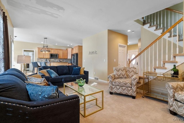 living room featuring light carpet