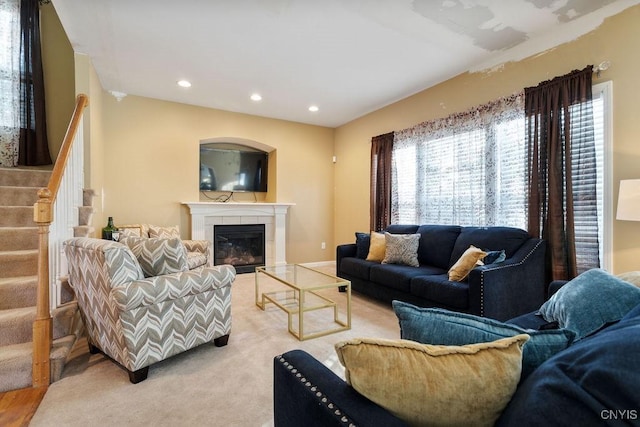 carpeted living room featuring a fireplace