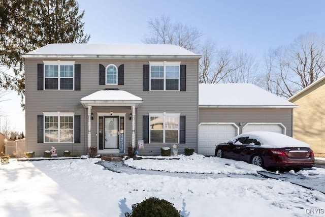 colonial house featuring a garage