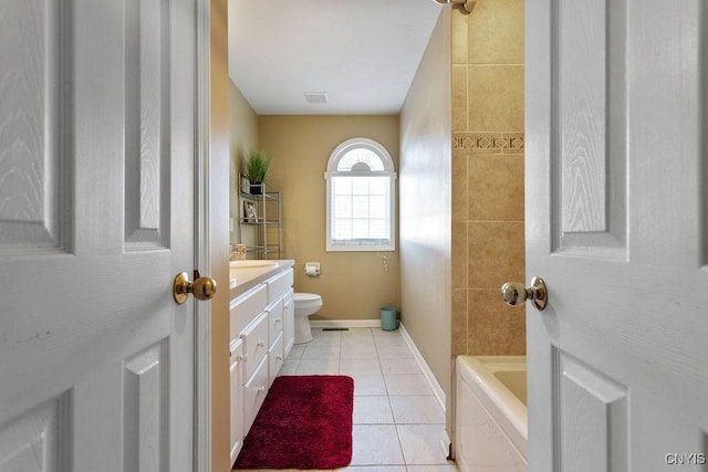 bathroom with vanity, toilet, and tile patterned flooring