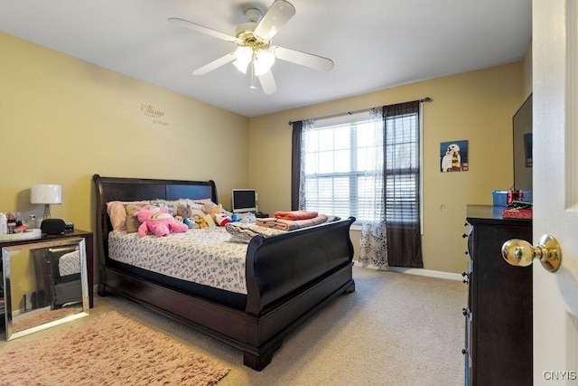 bedroom with light carpet and ceiling fan