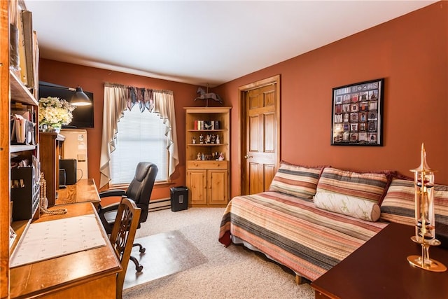 carpeted bedroom featuring baseboard heating