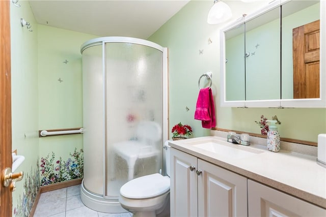 bathroom featuring tile patterned floors, an enclosed shower, vanity, and toilet