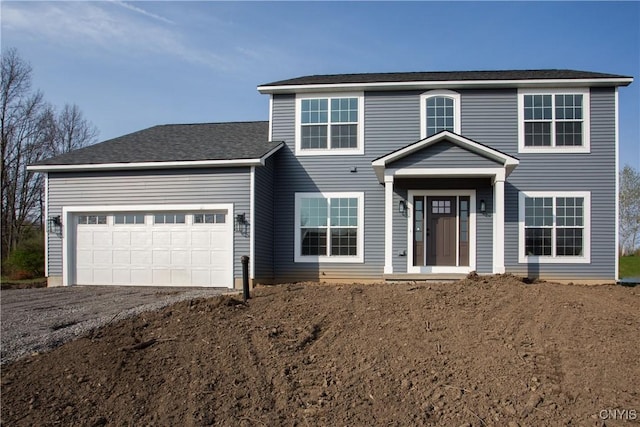 view of front of home with a garage