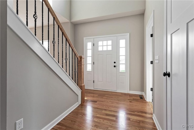 entryway with wood-type flooring