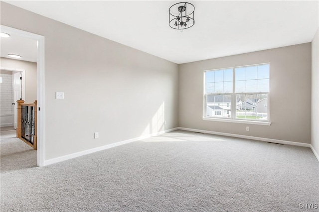 spare room with light colored carpet