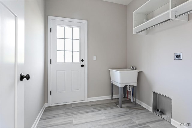 clothes washing area with electric dryer hookup