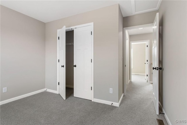 unfurnished bedroom with carpet and a closet