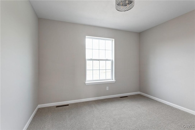 unfurnished room featuring carpet flooring