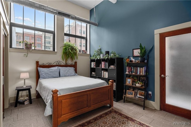 bedroom with carpet floors and baseboards