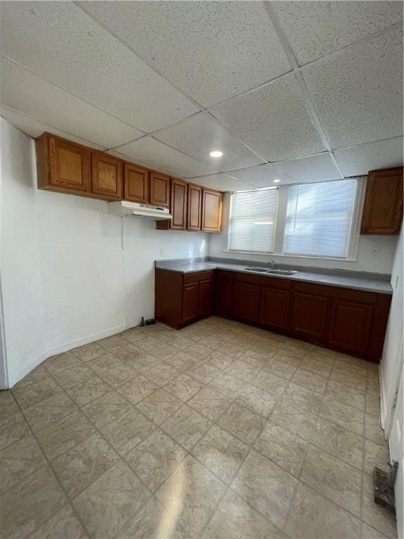 kitchen featuring sink and a paneled ceiling