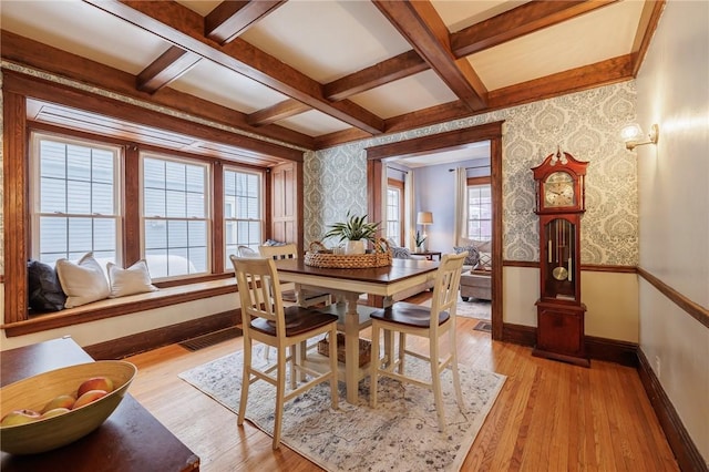 dining area featuring coffered ceiling, beam ceiling, and light wood-type flooring