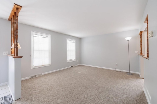 empty room featuring light carpet