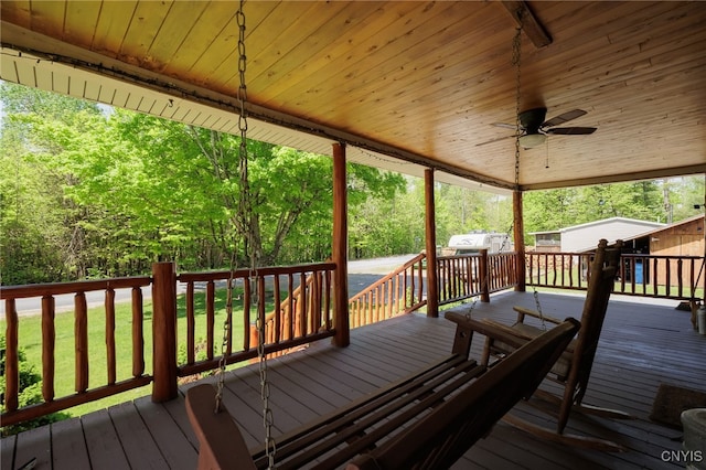 wooden terrace featuring ceiling fan