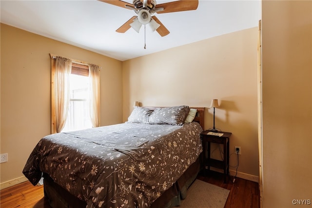 bedroom featuring ceiling fan and hardwood / wood-style flooring