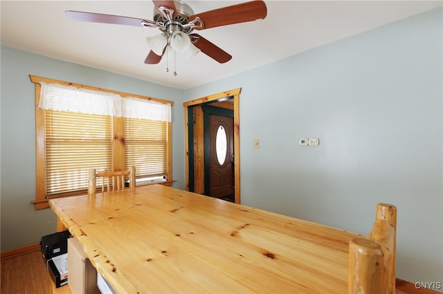 unfurnished dining area with ceiling fan and hardwood / wood-style floors