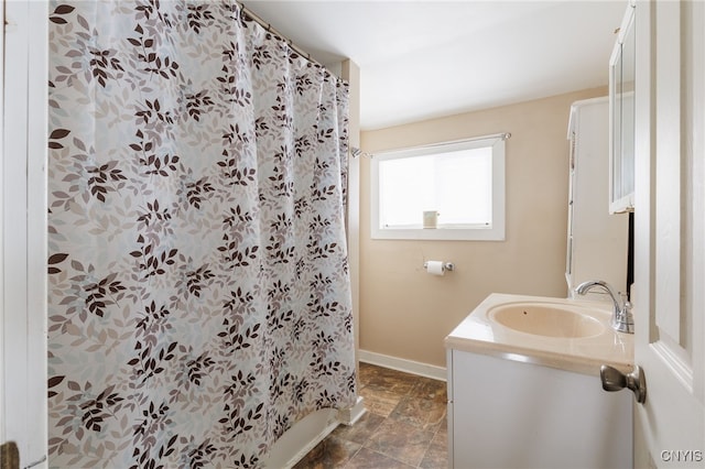 bathroom featuring vanity and a shower with curtain