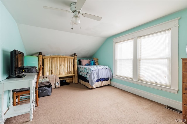 carpeted bedroom with lofted ceiling and ceiling fan