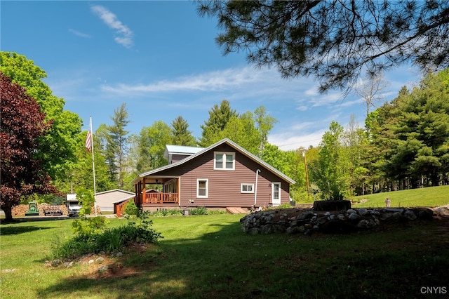 view of side of home with a wooden deck and a yard