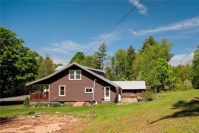 view of side of property with a yard