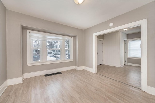 empty room with light wood-type flooring