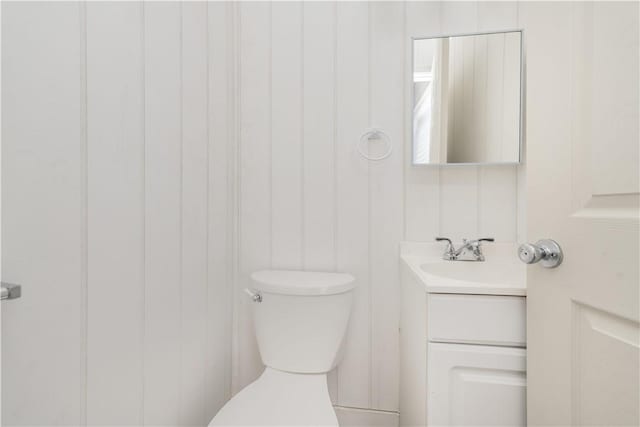 bathroom with toilet and vanity