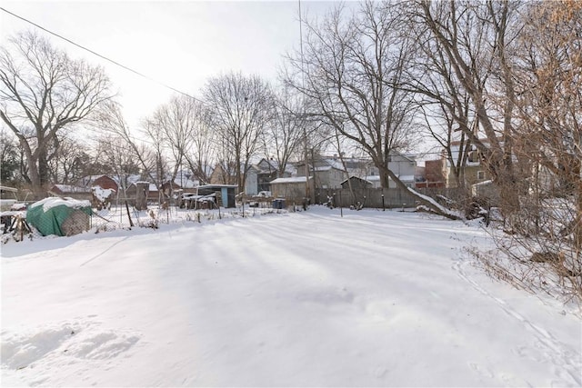 view of yard layered in snow