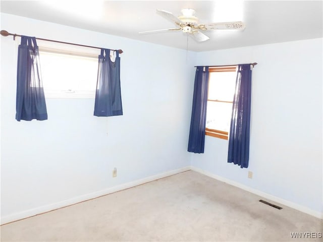 carpeted empty room with ceiling fan