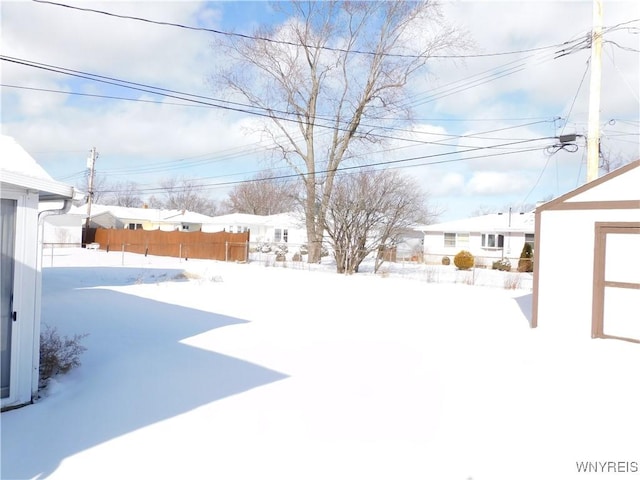 view of yard layered in snow