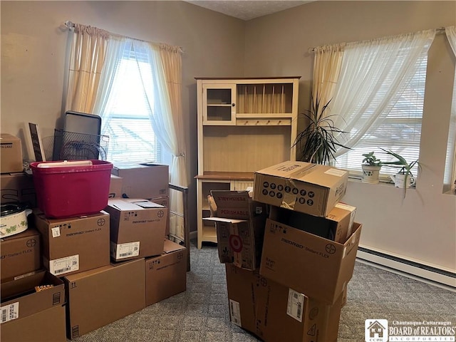 storage room featuring a baseboard radiator