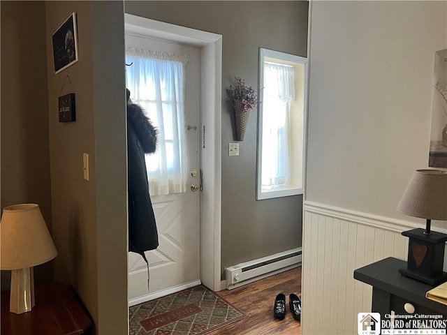 entryway featuring a baseboard heating unit and dark wood-type flooring