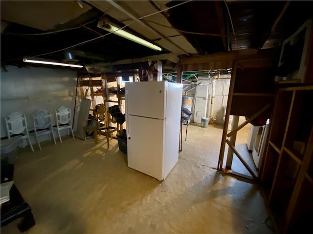 basement with white refrigerator